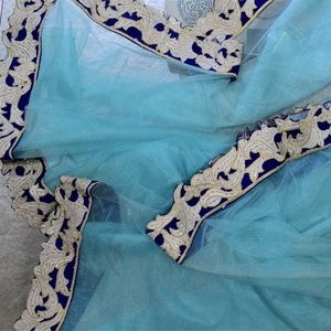 Net saree with embroidery and jacket style blouse